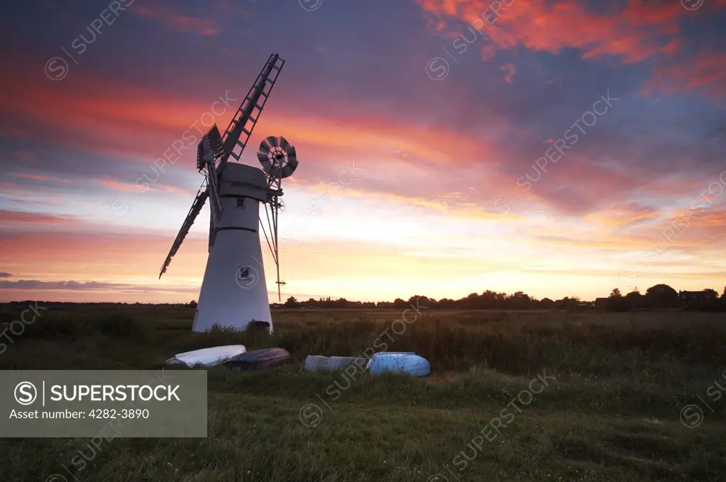 England, Norfolk, Thurne. Thurne Windmill at sunrise on the Norfolk Broads.