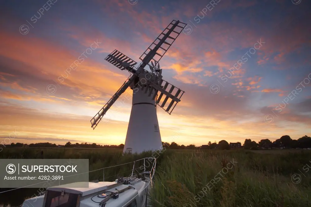 England, Norfolk, Thurne. Thurne Windmill at sunrise on the Norfolk Broads.