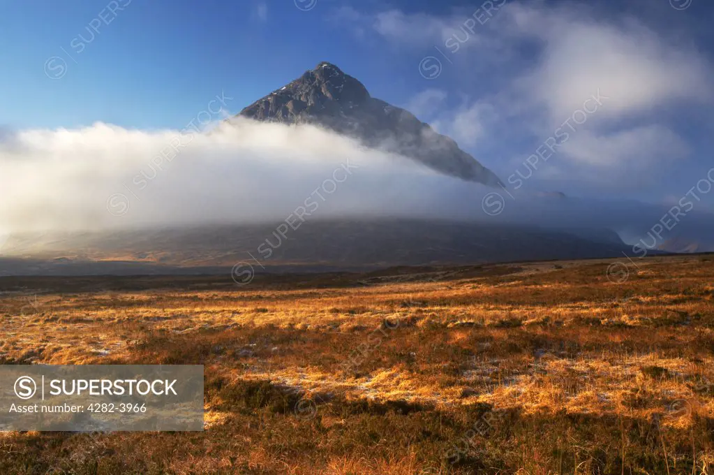 Scotland, Highland, Glen Etive. A view across frosty moorland to Buachaille Etive Mor Mountain in the Scottish Highlands.