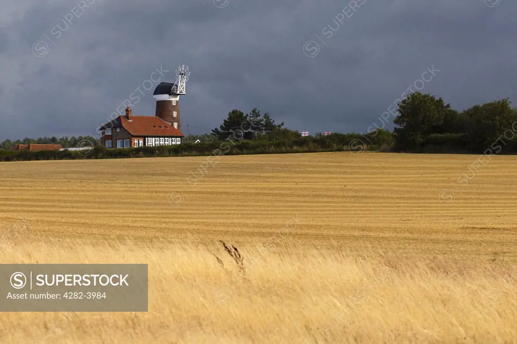 England, Norfolk, Weybourne. A storm passes over Weybourne Towermill in Norfolk.