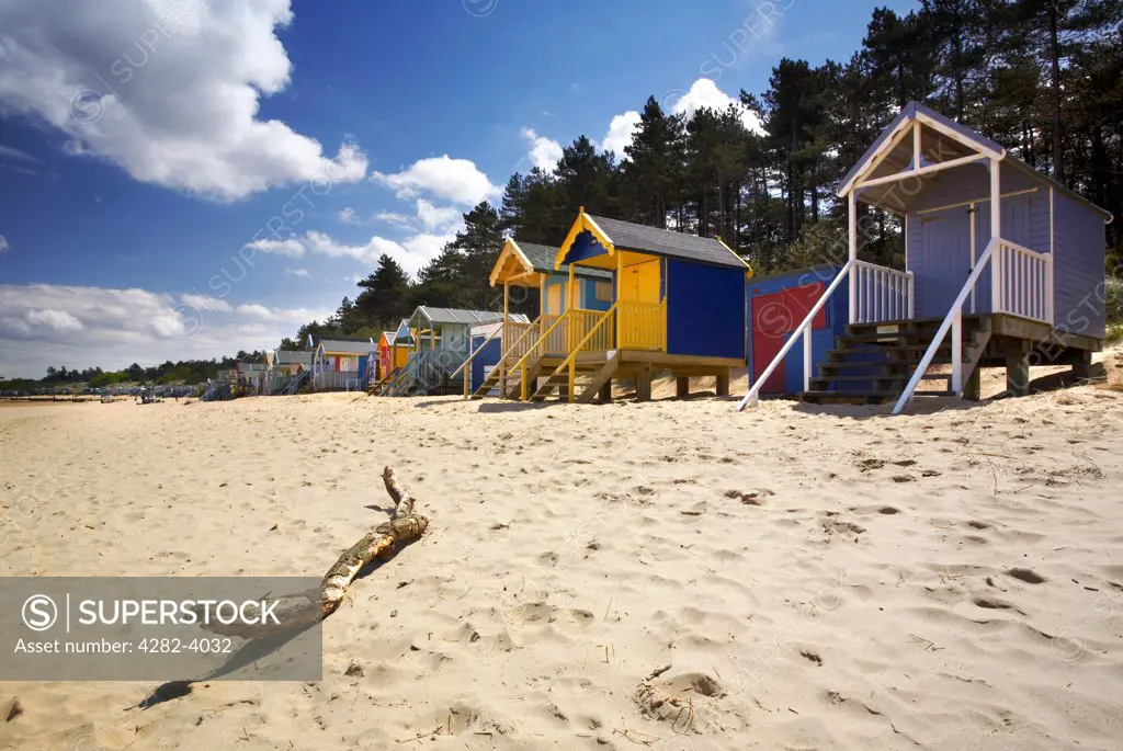 England, Norfolk, Wells-Next-The-Sea. Beach huts on the sandy beach at Wells-Next-The-Sea on the North Norfolk Coast.