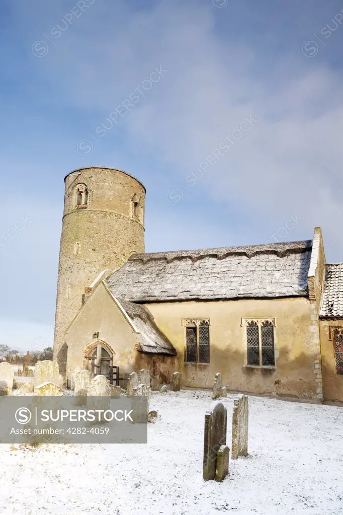 England, Suffolk, Herringfleet. Snow on and around the Norman church of Herringfleet St. Margaret.