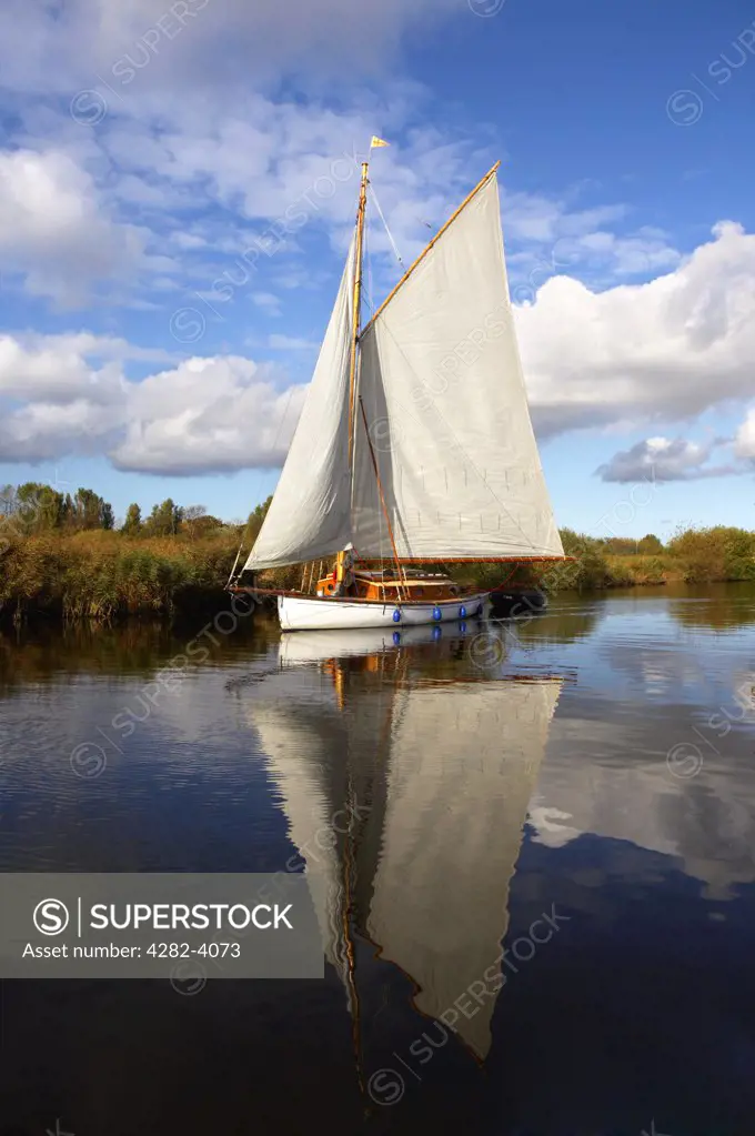 England, Norfolk. A traditional sailing boat on the Norfolk Broads.