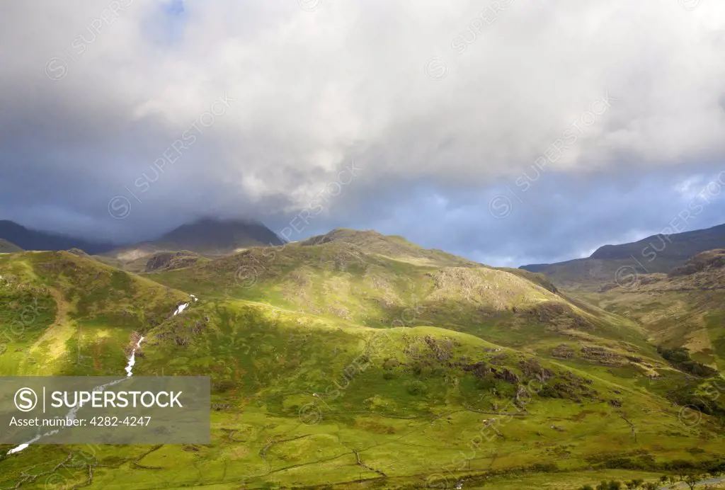 Wales, Gwynedd, Snowdonia National Park. Storm clouds over the Snowdon range of mountains in the Snowdonia National Park.