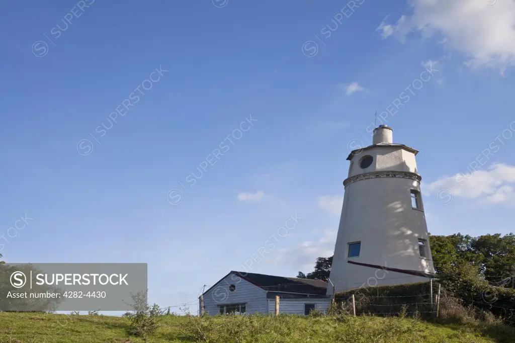 England, Lincolnshire, Sutton Bridge. The East Lighthouse, built in 1831 on the bank of the River Nene at Sutton Bridge. The lighthouse was used as a marker to guide ships into the Nene outfall cut.