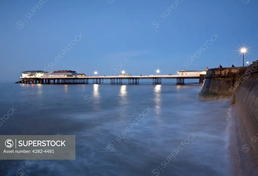 England, Norfolk, Cromer. Cromer Pier, home to the Cromer Lifeboat Station and the Pavilion Theatre, on the Norfolk coast at dusk.