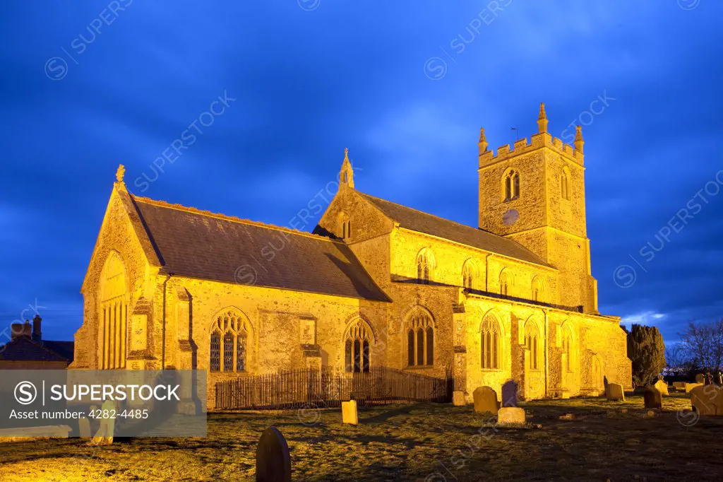 England, Norfolk, East Winch. The Parish Church of All Saints at East Winch, illuminated at night.