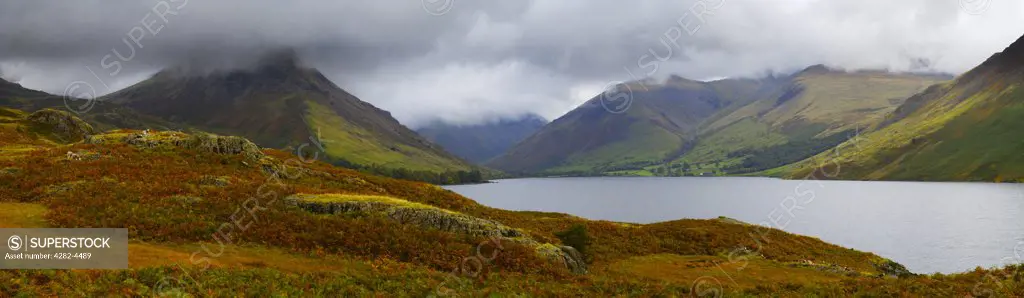 England, Cumbria, Wasdale. Panoramic view of Wast Water in The Lake District National Park. In the distance can be seen the Yewbarrow, Great Gable and Scafell Pike mountains.