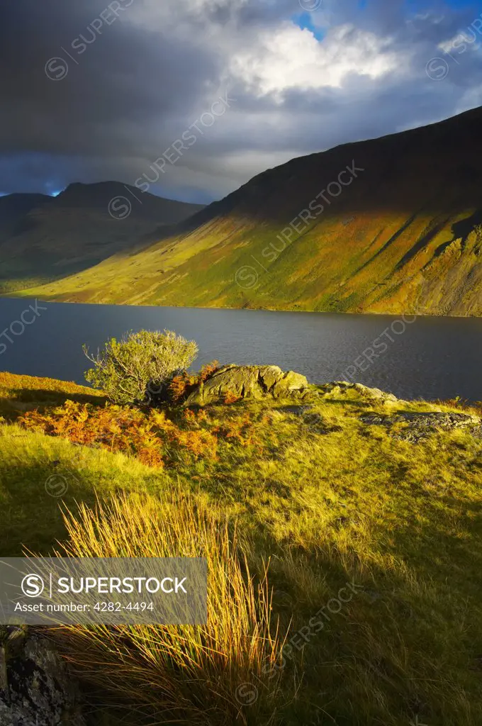 England, Cumbria, Wasdale. Wastwater in autumn in The Lake District National Park. Situated in the Wasdale Valley, Wastwater is 3 miles long, half a mile wide and 260 feet deep, and the deepest of all the lakes.