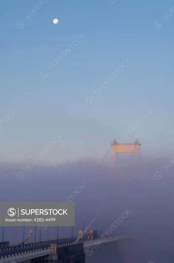 England, Gloucestershire, Aust. The Severn Bridge from the English side in morning fog.