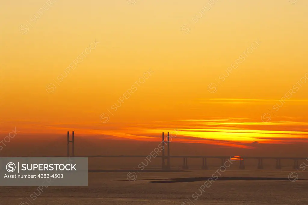 England, Gloucestershire, Severn Beach. A view to the second Severn Crossing at sunset.