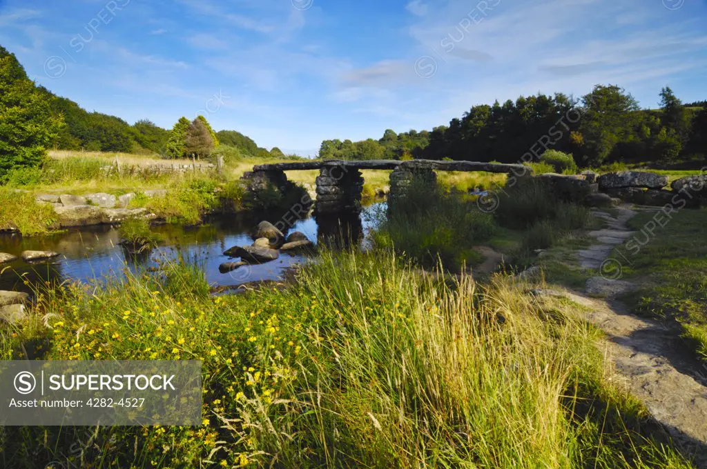 England, Devon, Postbridge. The ancient clapper bridge over East Dart River at Postbridge on Dartmoor.