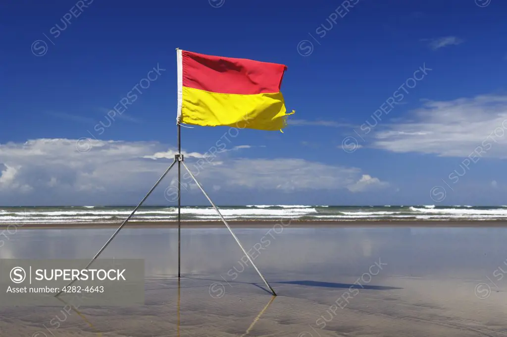 England, Devon, Westward Ho!. A lifeguard's safety flag on Westward Ho! beach. At Westward Ho! there are two miles of sandy beach known as the Golden Bay.
