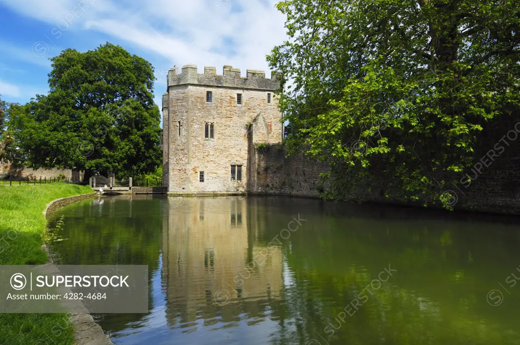 England, Somerset, Wells. The moat and outer wall around the Bishop's Palace and gardens.