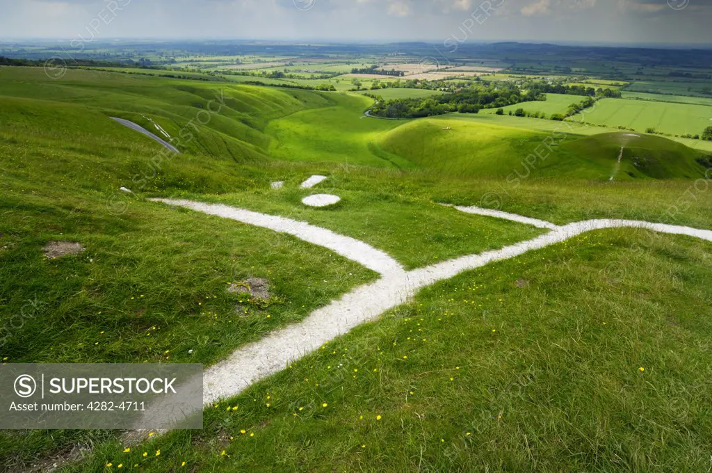 England, Oxfordshire, Uffington. View over the Vale of White Horse and the Uffington White Horse from Whitehorse Hill.