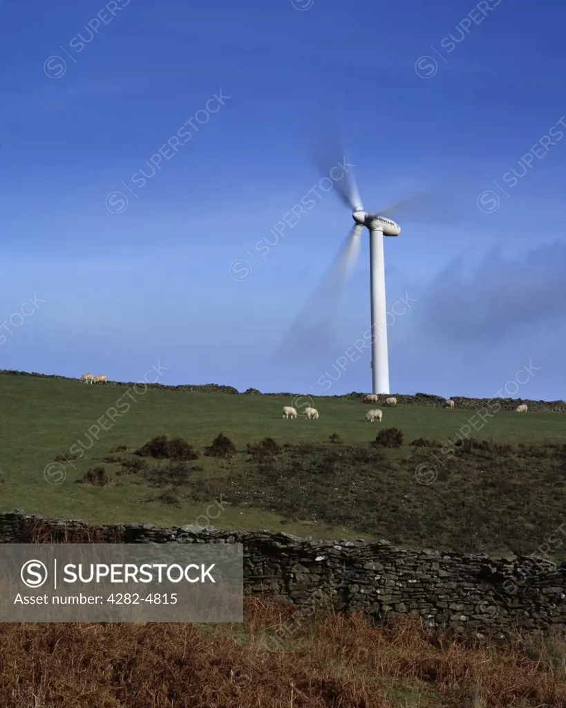 South Wales, Glamorgan, Bridgend. A view over farmland toward a wind turbine at the Gilfach Gogh Wind Farm near Bridgend and Pontypridd.