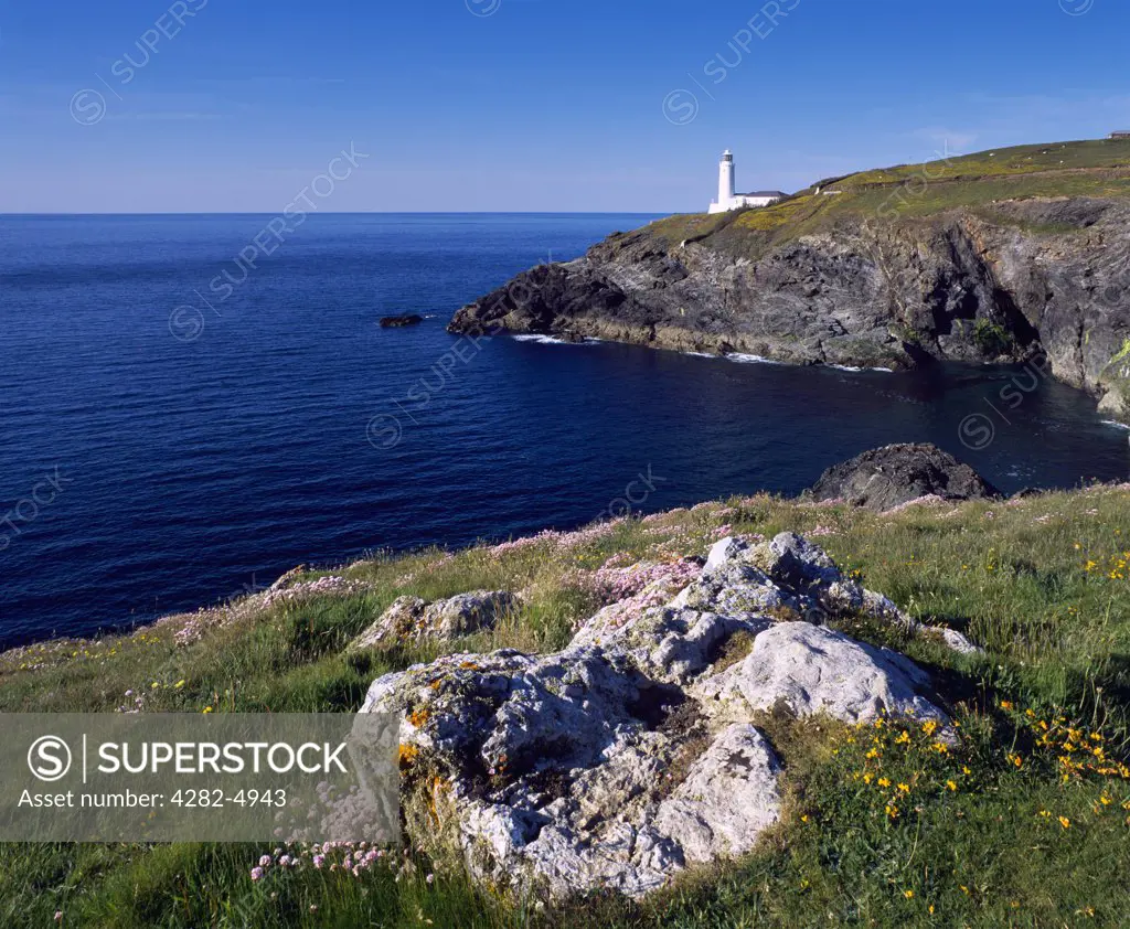 England, Cornwall, Trevose Head. Stinking Cove and the lighthouse at Trevose Head viewed from Dinas Head on the North Cornwall coast near Padstow.