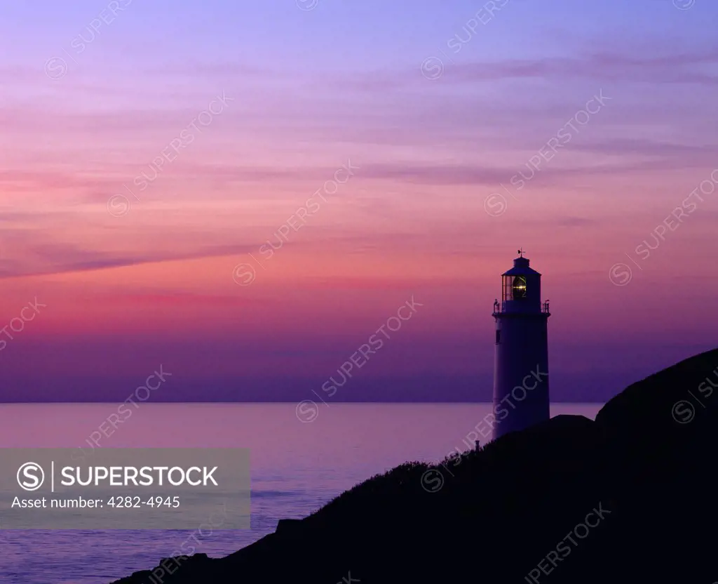 England, Cornwall, Trevose Head. Silhouette of the lighthouse at Trevose Head at dusk on the North Cornwall coast near Padstow.