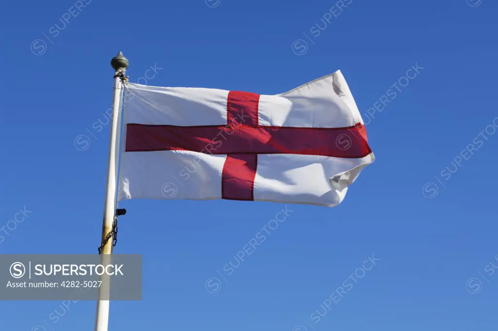 England, Devon, Budleigh Salterton. An England flag flying against a blue sky on a summers day.