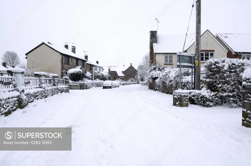 England, Somerset, Wrington. Winter snow in Silver Street in the village of Wrington.