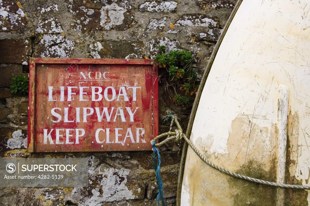 England, Cornwall, Bude. A keep clear sign for a lifeboat slipway on a wall at Bude Harbour.