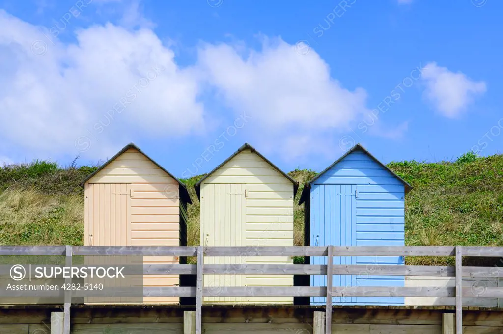 England, Cornwall, Bude. Colourful beach huts at Summerleaze Beach in Bude.