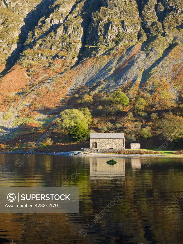 England, Cumbria, Nether Wasdale. The pumping station on the shore of Wastwater, England's deepest lake, by The Screes in the Lake District National Park.
