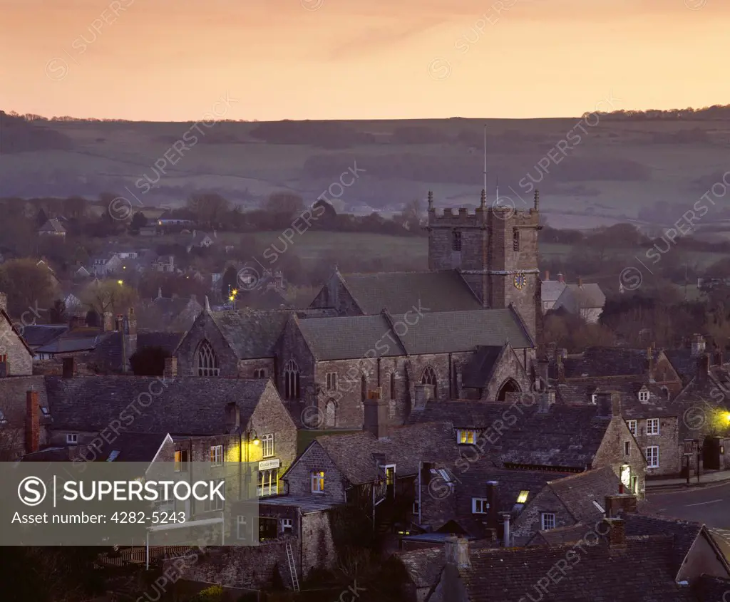 England, Dorset, Corfe Castle. The village of Corfe Castle at dusk near Swanage and Wareham on the Isle of Purbeck.