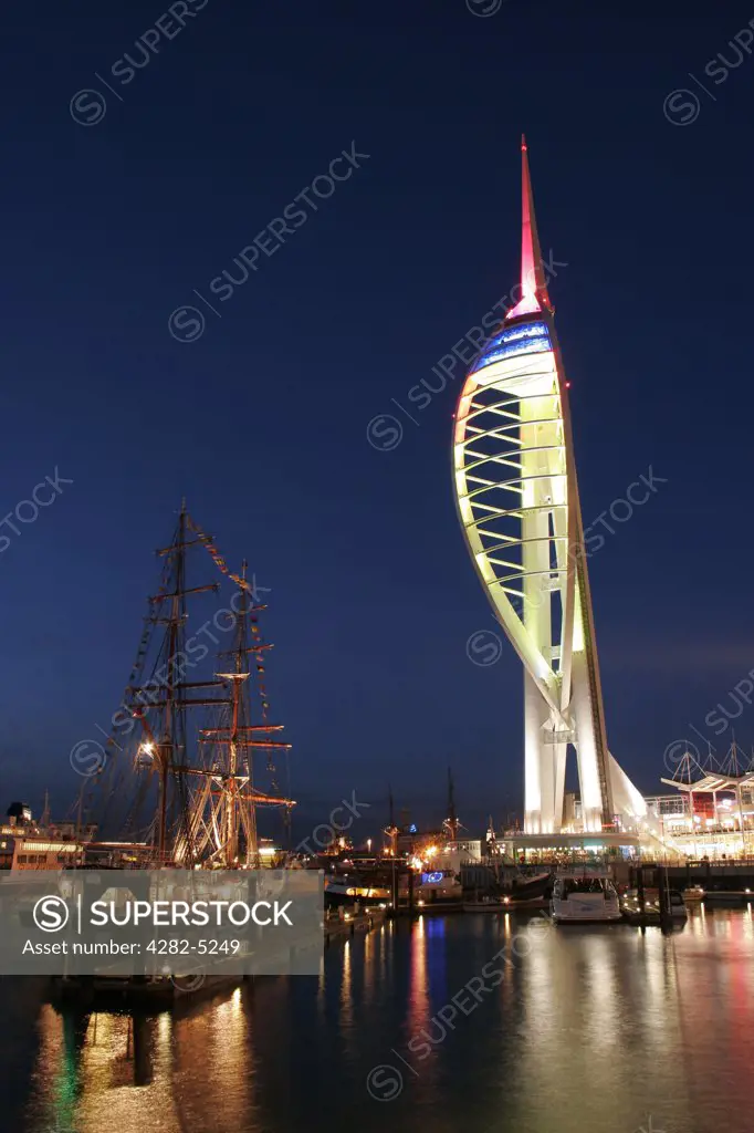 England, Hampshire, Portsmouth. A night view of the Spinnaker Tower at Gunwharfs Quays.