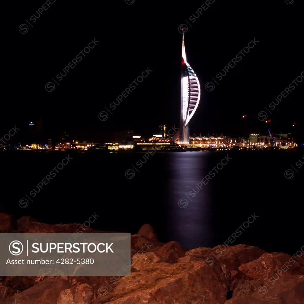 England, Hampshire, Portsmouth. The Spinnaker Tower at night. Opened in 2005, it stands 170m (557 ft) high, has  3 observation decks, 550 stairs and 2 lifts.