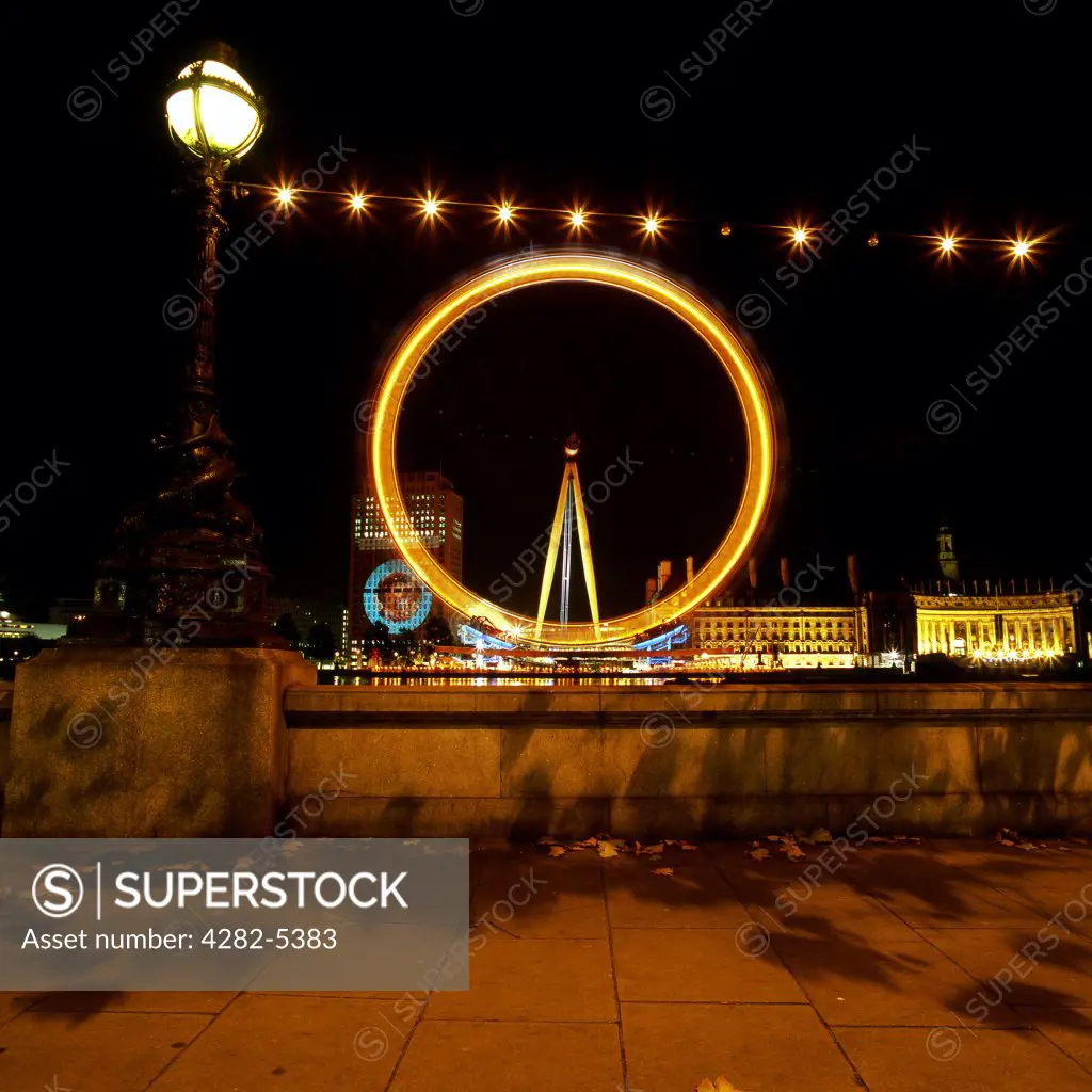 England, London, South Bank. The British Airways London Eye at Night. Opened in 1999, it stands 135m high making it the largest observation wheel in the world.