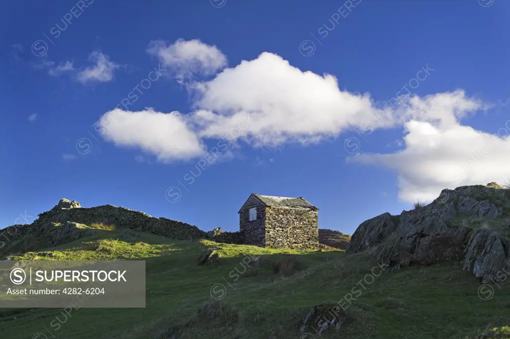England, Cumbria, Cumbrian Fells. A small slate stone shed on the Cumbrian Fells.