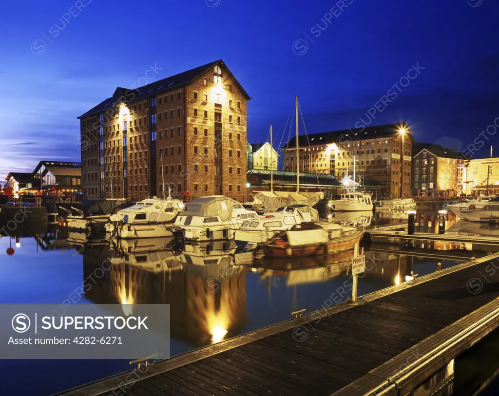 England, Gloucestershire, Gloucester. Victoria Dock, part of Gloucester Dock by night. The Britannia Warehouse (centre) is a modern replacement after the original warehouse was destroyed by fire in 1987.