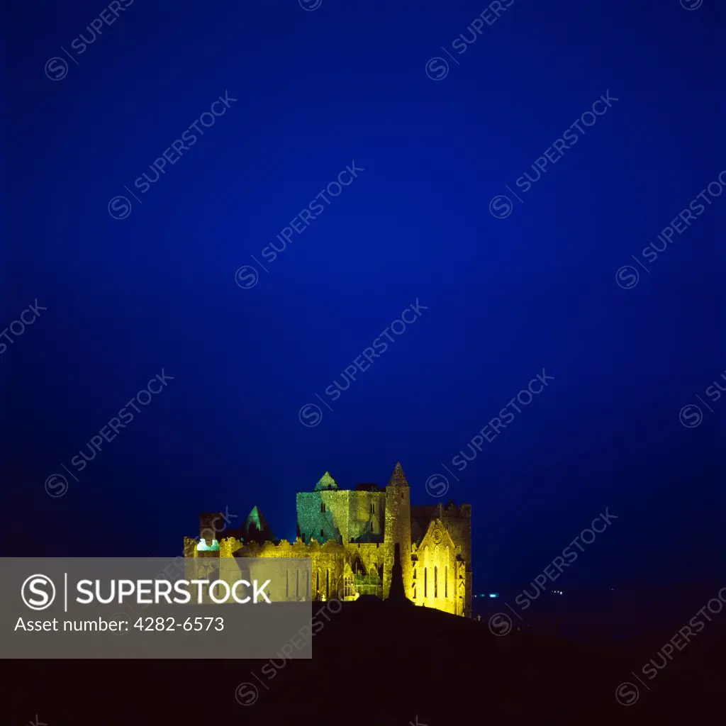 Ireland, County Tipperary, Cashel. The Rock of Cashel also known as Cashel of the Kings and St. Patrick's Rock illuminated at dusk. The Rock of Cashel was the traditional seat of the kings of Munster before the Norman invasion.