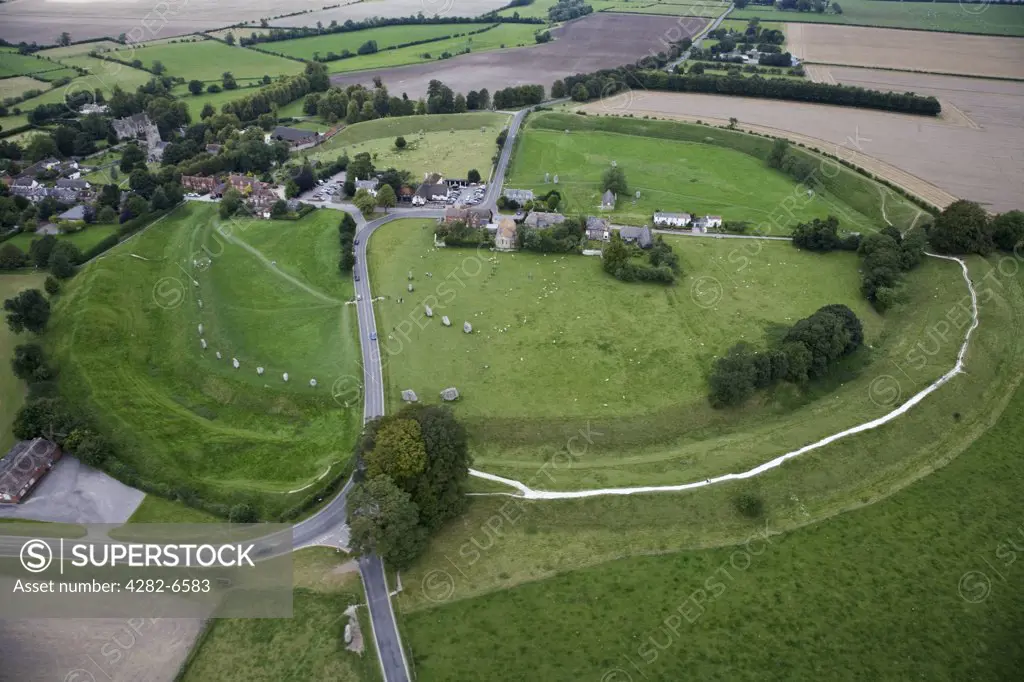 England, Wiltshire, Avebury. Aerial view of the village of Avebury and Avebury stone circle, a world heritage site and one of Europe's largest prehistoric stone circles.