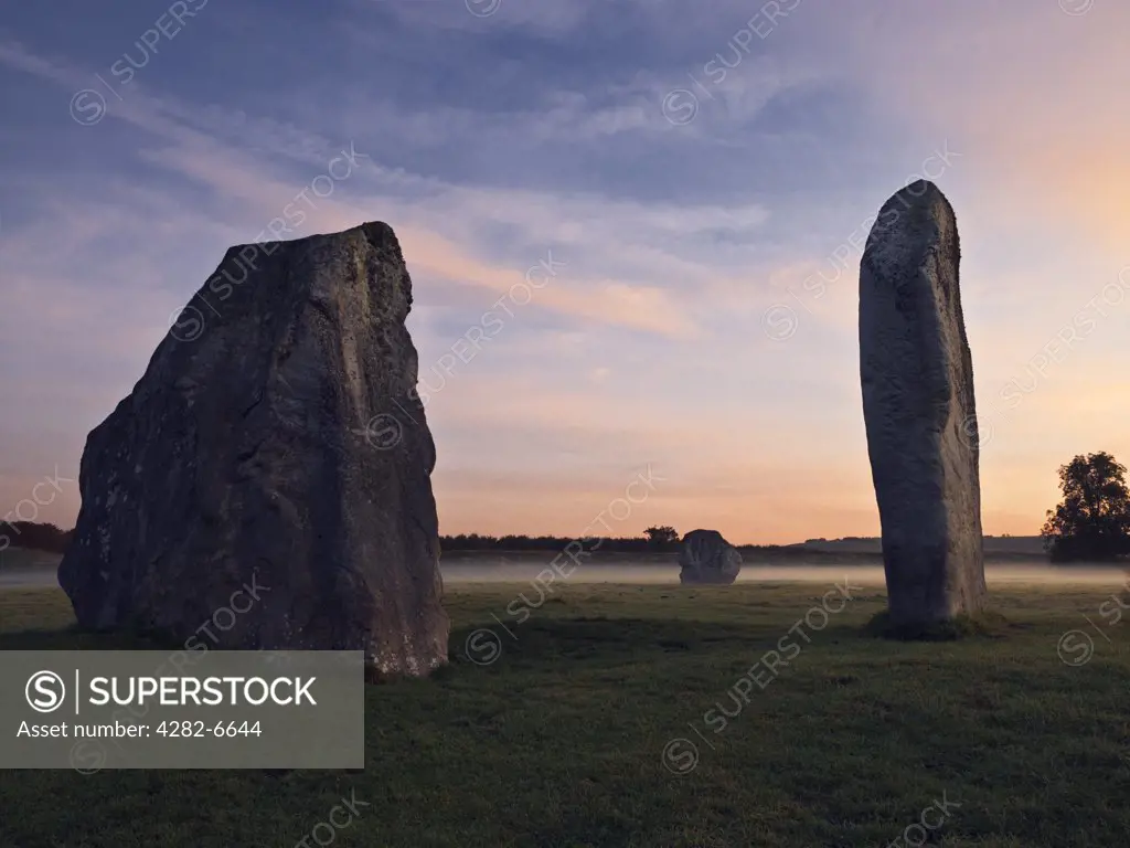 England, Wiltshire, Avebury. Part of the Avebury stone circle, one of Europe's largest prehistoric stone circles, at dawn.