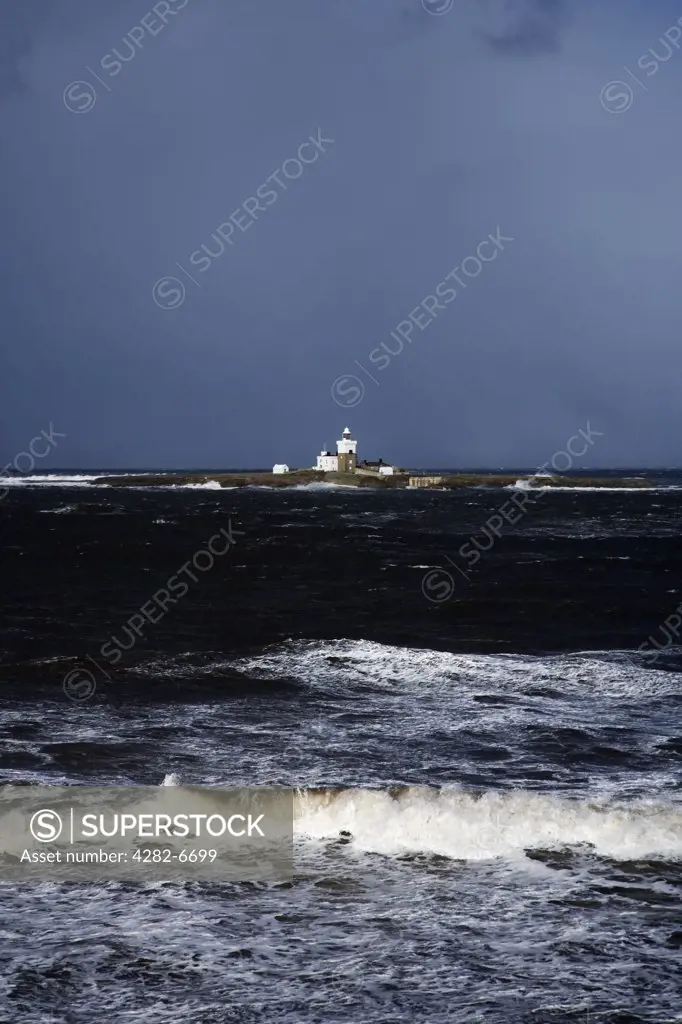 England, Northumberland, Coquet Island. Coquet Island Lighthouse and lighthouse keepers' cottages which incorporate the remains of a medieval monastery. The island is uninhabited and managed by the RSPB as a bird reserve.
