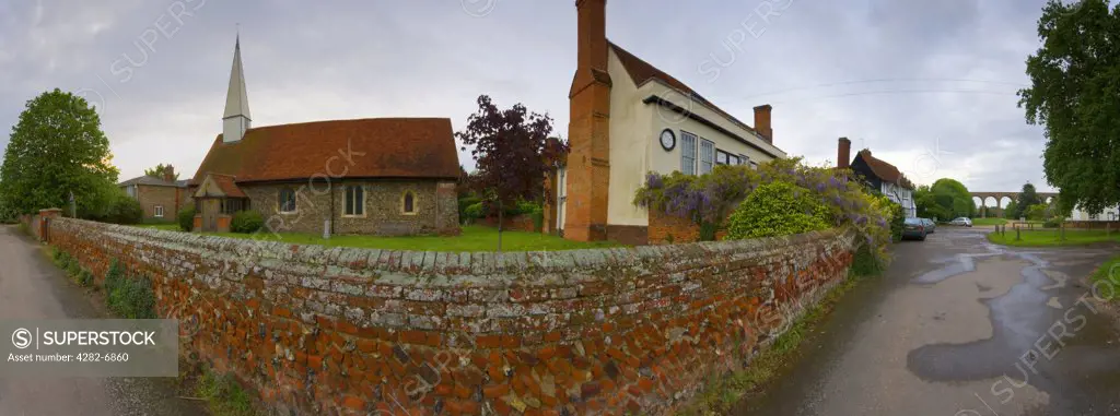 England, Essex, Colchester. A view of the village of Chappel looking at the church and across to the viaduct.