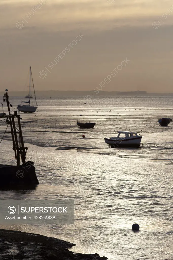 England, Essex, Leigh-on-Sea. Small boats moored in the estuary at Leigh-on-Sea in Essex.