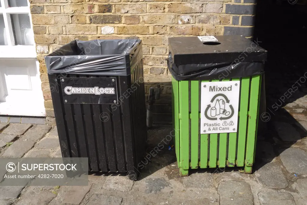 England, London, Camden market. Rubbish bin and recycling bin side-by-side in Camden market.