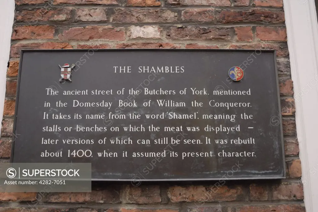 England, North Yorkshire, York. Close-up of a plaque on a wall explaining the history of the Shambles in York.