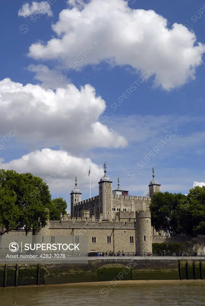 England, London, Tower of London. The Tower of London viewed from a boat on the river Thames.