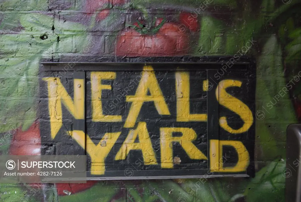 England, London, Covent Garden. A sign painted on the wall of an alleyway leading to Neal's Yard in Covent Garden.