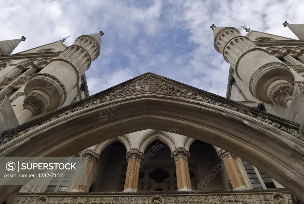 England, London, Fleet Street. Looking up at the front of the Royal Courts of Justice. The Royal Courts of Justice was opened in 1882 and today houses both the Court of Appeal and the High Court.