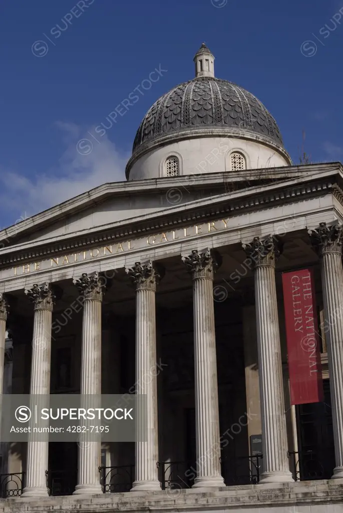 England, London, National Gallery. Front view of The National Gallery. The National Gallery was originally established in 1824 when 36 paintings were bought for the country from a banker, John Julius Angerstein.