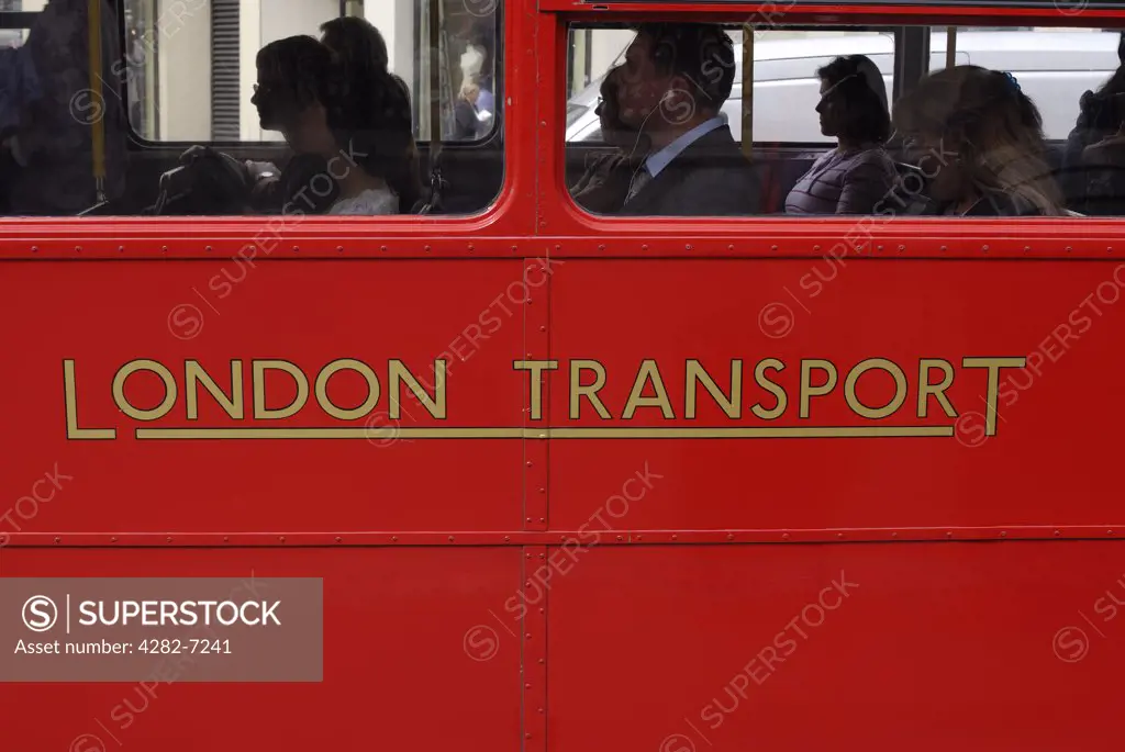 England, London, London. Passengers on the bottom deck of a Routemaster bus. Routemasters used to be common on the streets of London but have now been replaced by more modern double-deckers and the so-called bendy buses.