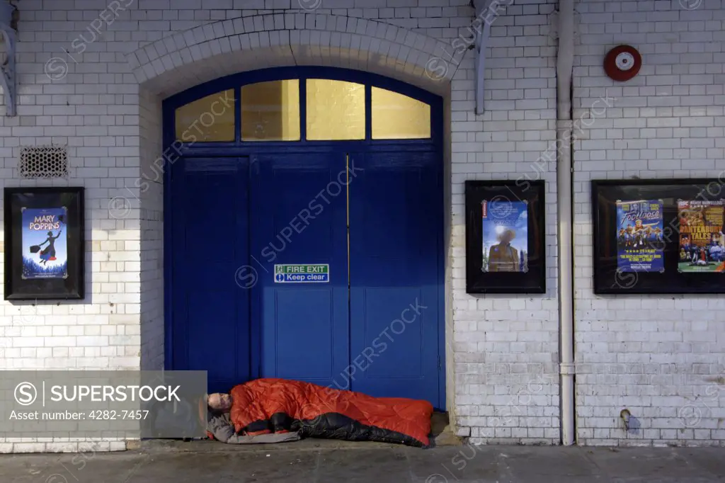 England, London, Covent Garden. Homeless man sleeping in the doorway of a building in Covent Garden in London. There are about 220 people who sleep on the streets of London every night.