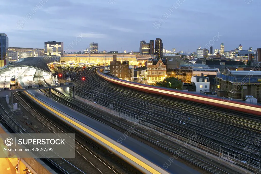 England, London, Waterloo. Dusk view of trains arriving and leaving Waterloo train station.