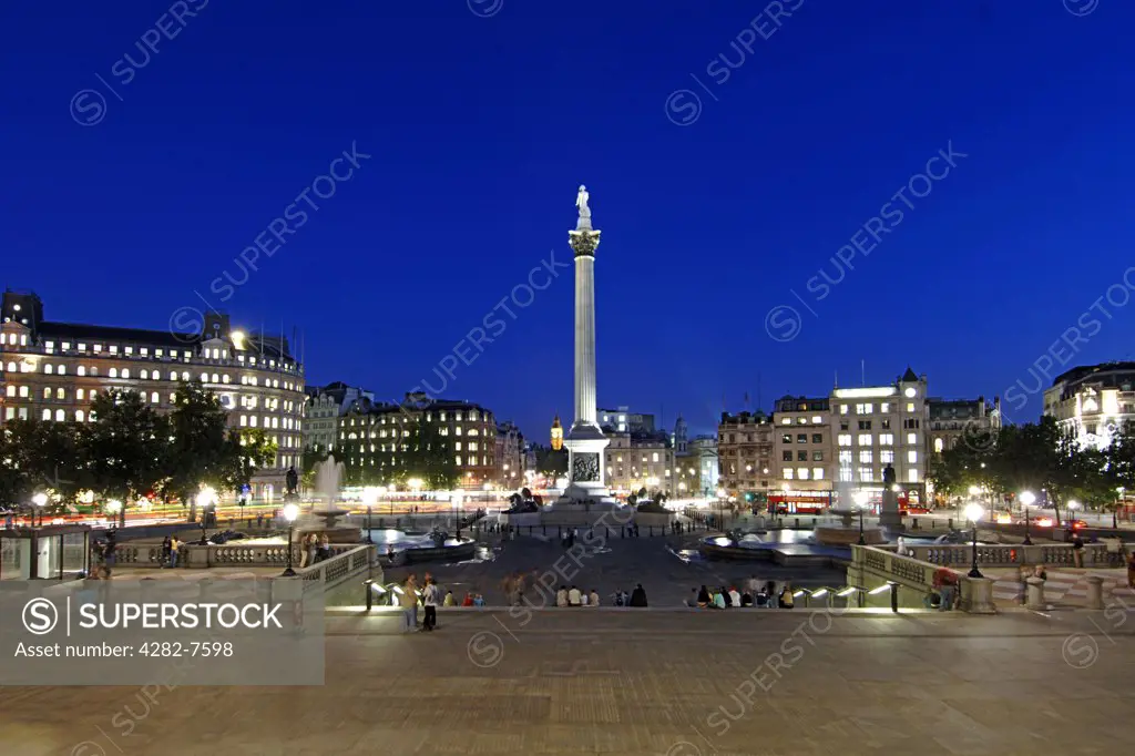 England, London, Trafalgar Square. An illuminated Trafalgar Square and Nelsons Column at dusk.