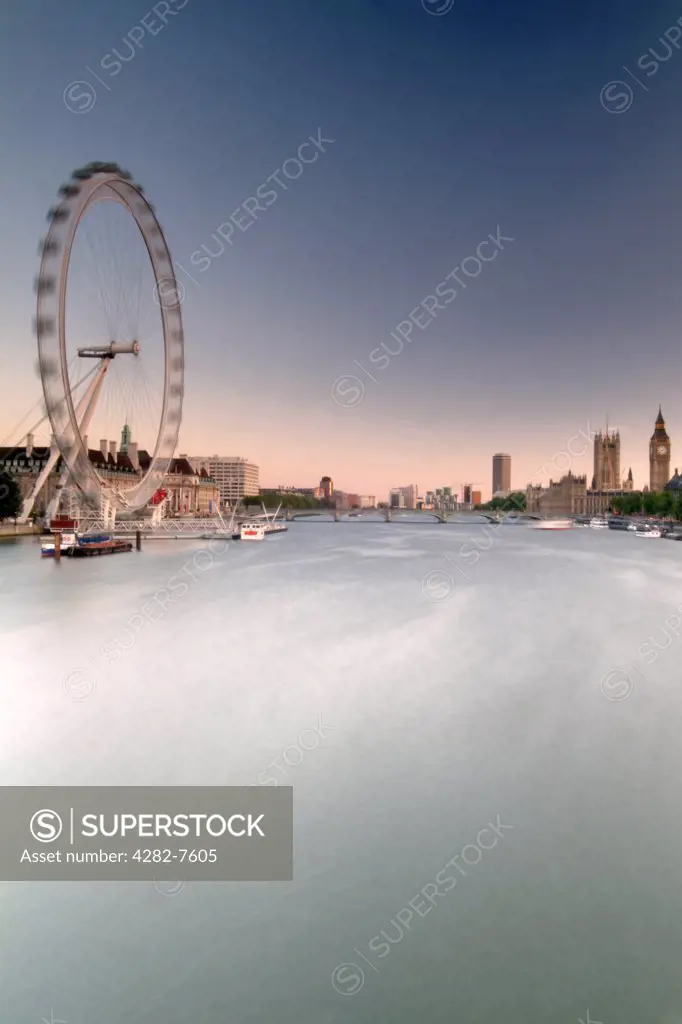 England, London, South Bank. A view down the River Thames to the London Eye and Houses of Parliament.